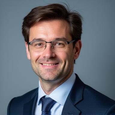 Professional headshot of Dr. Alistair Finch.